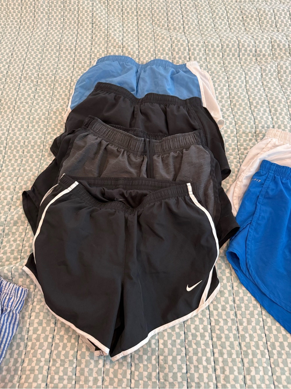 Nike Black Shorts with White Trim and Swoosh. 4 pairs. Juniors Med